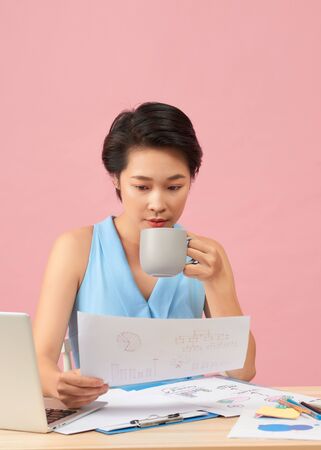 Attractive office worker resting in officeの写真素材