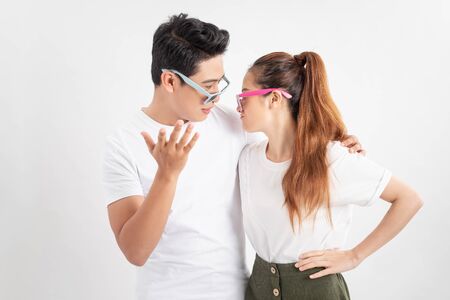 summer accessory, eyewear and people concept - portrait of happy couple in white t-shirts and...