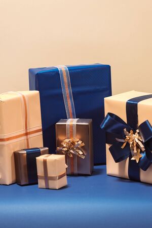 Christmas box with gifts and color bow  on light background