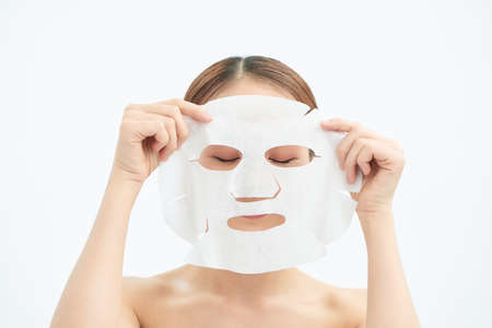 closeup young beauty face and facial maskの写真素材