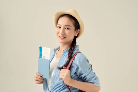woman tourist traveler holding passport excited for travelの写真素材