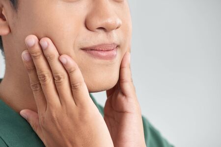 Men Face Care. Man Touching Smooth Skin After Shavingの写真素材