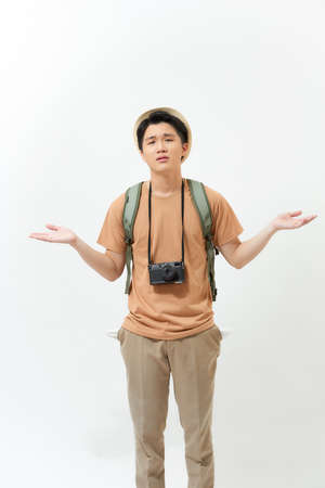Being poor. Nice cheerful man looking at his pockets while not having moneyの写真素材