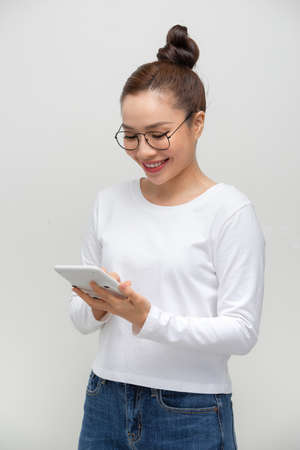 A woman with a calculatorの写真素材