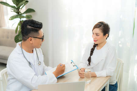 Healthcare concept of Obstetrician-gynecologist doctor consult with young woman about her health in clinic or hospital.の写真素材