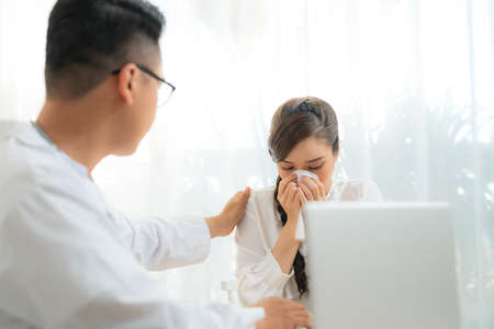 Doctor (obstetrician, gynecologist or psychiatrist) consulting and diagnostic examining woman patient's obstetric - gynecological health in medical clinic or hospital healthcare service centerの写真素材