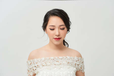 Beautiful bride with stylish makeup in white dressの写真素材