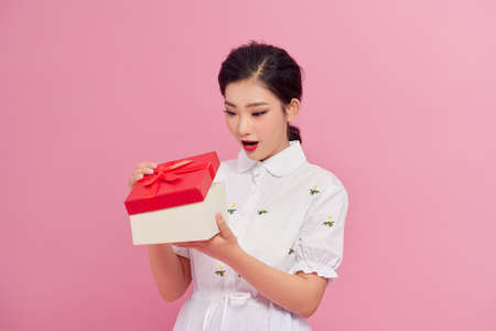 Woman with a present. Happy girl with a gift.