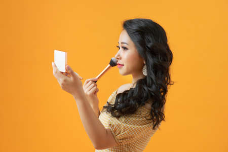 Makeup Applying closeup. Cosmetic Powder Brush. Perfect Skinの写真素材