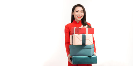 Woman giving a present for young, wish young a have a happy new yearの写真素材