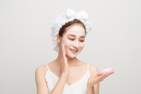 beautiful girl in the bathroom and mask for facial skin careの写真素材