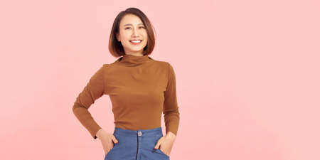 Photo of cool attractive business lady friendly smiling responsible isolated pink color backgroundの写真素材