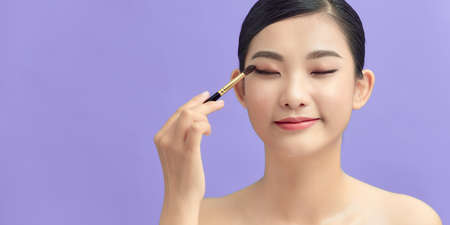 Young beautiful female fashion model with make upの写真素材