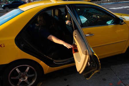 Traveller opening or closing car door.の写真素材