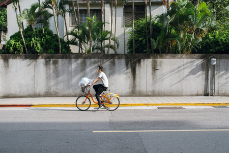 Taipei, Taiwan - July 2, 2018: Unidentified name people riding bicycle on the street at Taipei, Taiwan.の写真素材