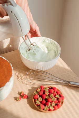 Whip cream preparing to make sponge cake or red velvetの写真素材