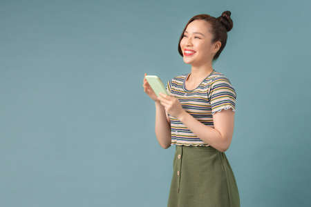 Asian Woman use of mobile phoneの写真素材