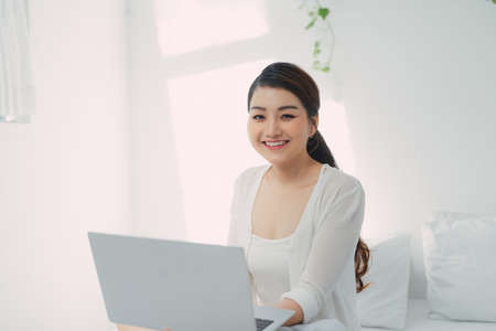 Asian woman use notebook laptop work from homeの写真素材