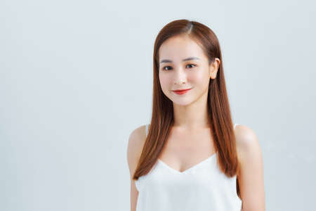 Beautiful smiling woman with clean skin, natural make-up.の写真素材