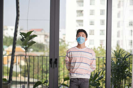 Danger of infection of the virus coronavirus infection. Businessman in medical mask at office