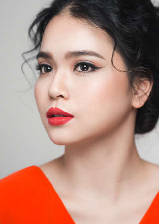Fashion portrait of asian woman with elegant hairstyle. Perfect makeup.の写真素材