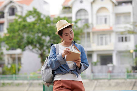 Female college student relax and enjoy outdoor lifestyle activity in summer dayの写真素材