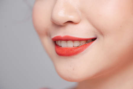 Close-up beauty portrait of woman face with sexy red lipsの写真素材