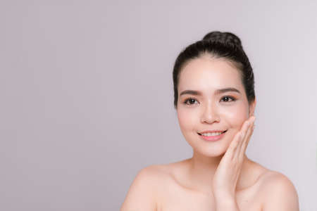 Beautiful woman face studio on white with sexy lipsの写真素材