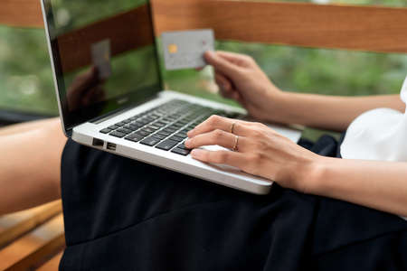 Asian woman using laptop and credit card shopping ecommerceの写真素材