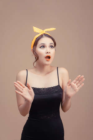Portrait of lovely amazed cheerful girl sudden good news reaction delight isolated over pink pastel color backgroundの写真素材