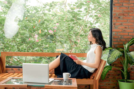 Young woman doing research work for her business.の写真素材