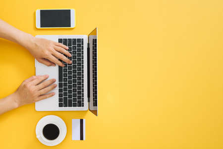 Workspace with laptop, girl's hands.Flat lay computerの写真素材