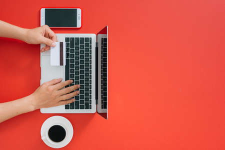 Top view of male hands making online paymentの写真素材