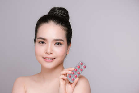 Girl is holding medicaments in handsの写真素材