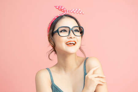 Portrait of beautiful asian girl laughing out loud on some joke or funny story.の写真素材