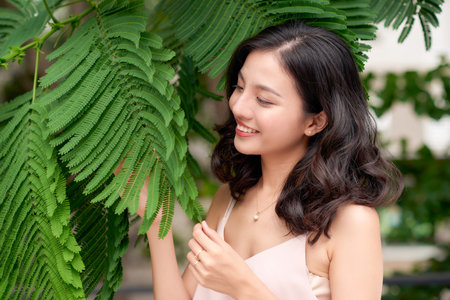 Woman around a beautiful gardenの写真素材