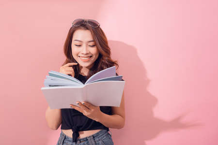 Beautiful woman reading a bookの写真素材