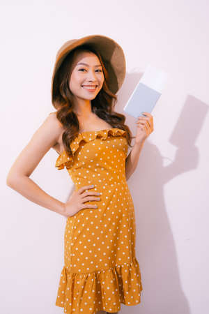 Woman traveler with passport and ticket on white backgroundの写真素材