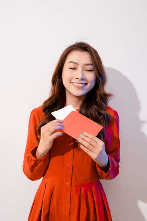 Attractive woman with postcard, on white backgroundの写真素材