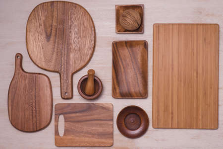 Set of kitchen utensils on vintage planked wood table from above, wooden backgroundの写真素材