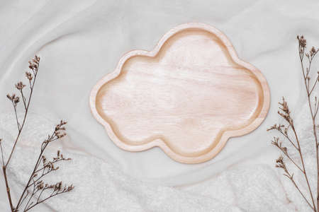 Natural wooden tableware on tableclothの写真素材
