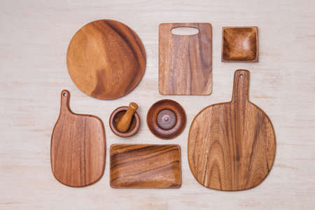 Set of kitchen utensils on vintage planked wood table from above, wooden backgroundの写真素材
