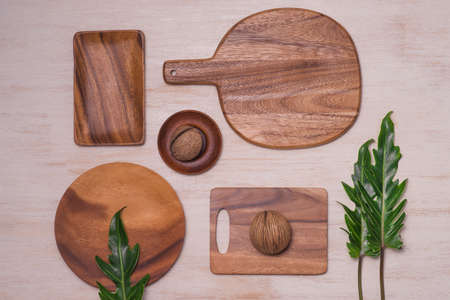 Kitchen cooking utensils and cutting boards isolated on wooden background.の写真素材