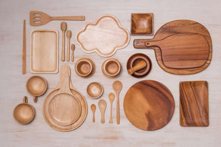 Kitchen cooking utensils and cutting boards isolated on wooden background.の写真素材