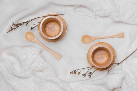 Wooden tea cup on wooden table background.の写真素材
