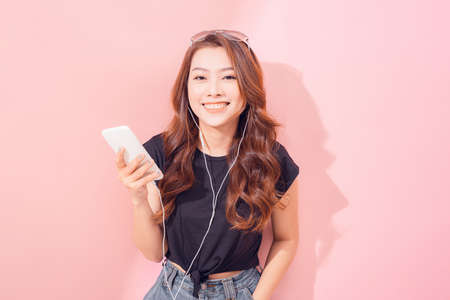 young woman listening to musicの写真素材