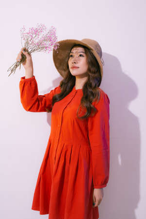 Woman holding a bouquet of dry flowersの写真素材