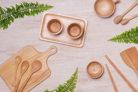 Kitchen cooking utensils and cutting boards isolated on wooden background.の写真素材