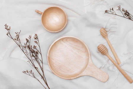 Different wooden kitchenware on wooden table, close upの写真素材