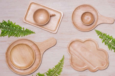 Rural kitchen utensils on vintage planked wood table from above, wooden backgroundの写真素材